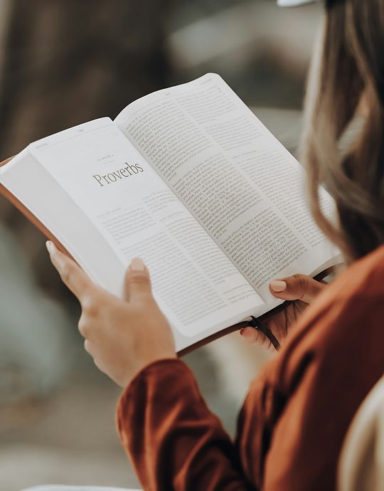 closeup of girl reading bible