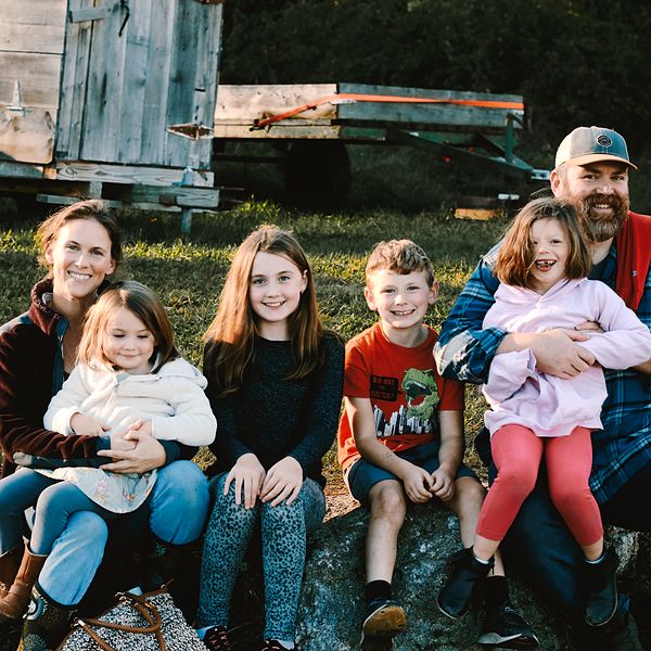 family of six laughing together