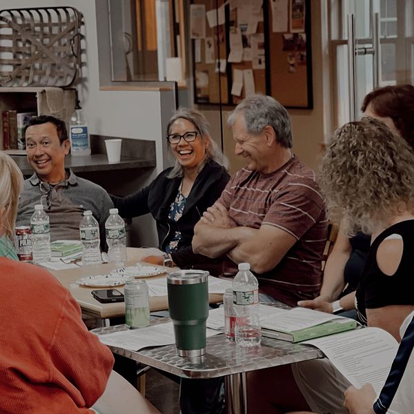 family laughing at table