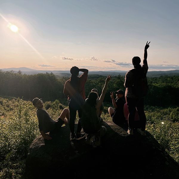 young adults looking at mountains