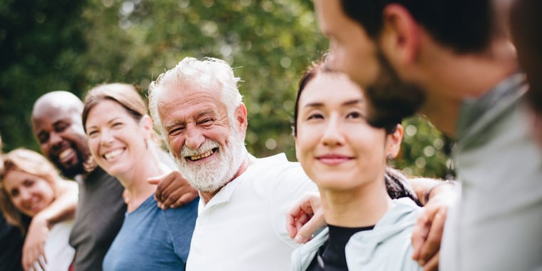 group of people with their arms around each other