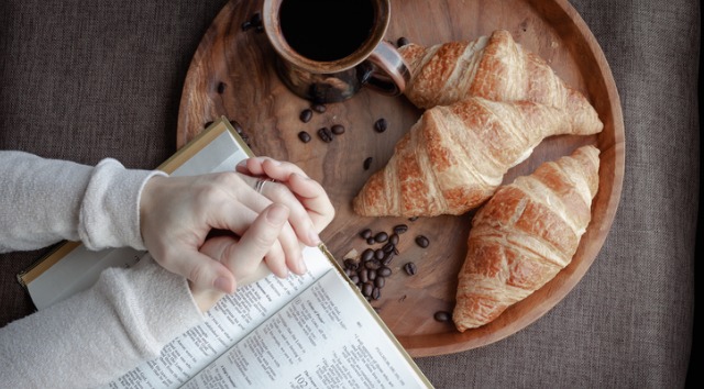 hands in prayer over a meal