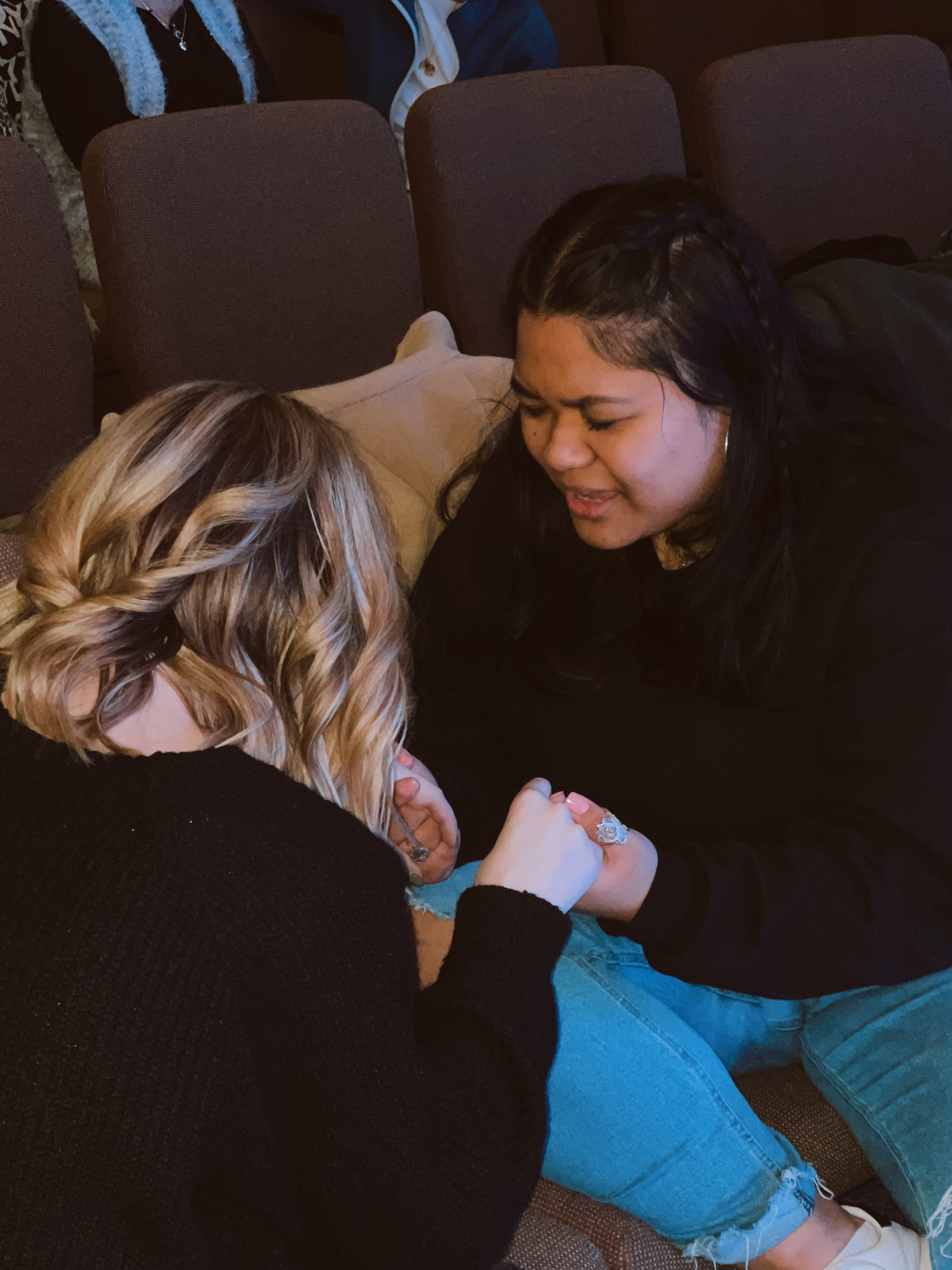 two women praying together